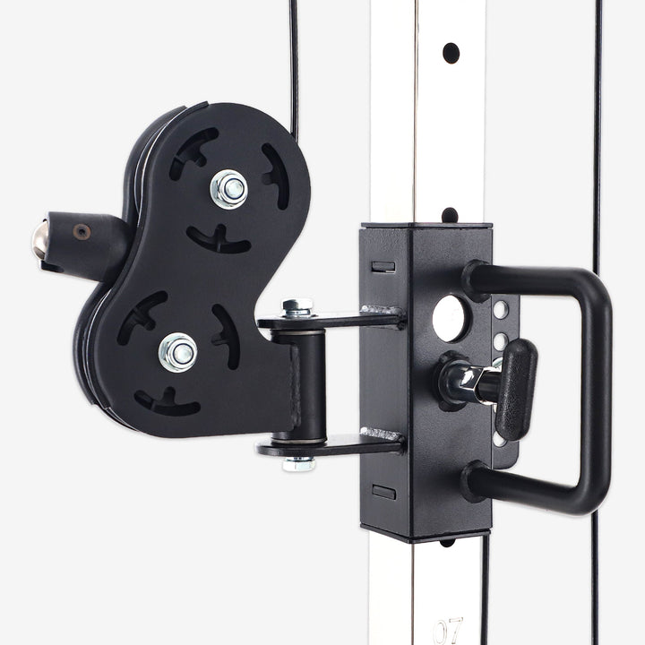 Black pulley system attached to a white wall