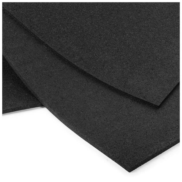Close-up of black rubber sport and fitness mats, ideal for home gyms and workshops, durable, waterproof, and non-slip.