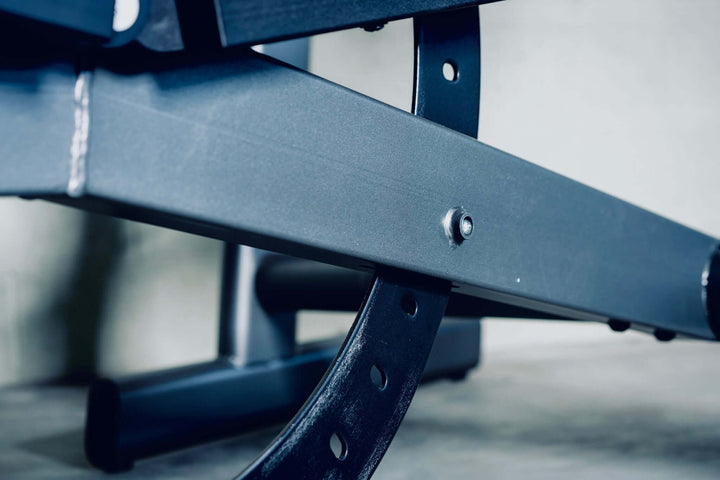 Close-up of X-RIVAL ABP30 heavy-duty bench frame showcasing sturdy steel construction for reliable workouts.