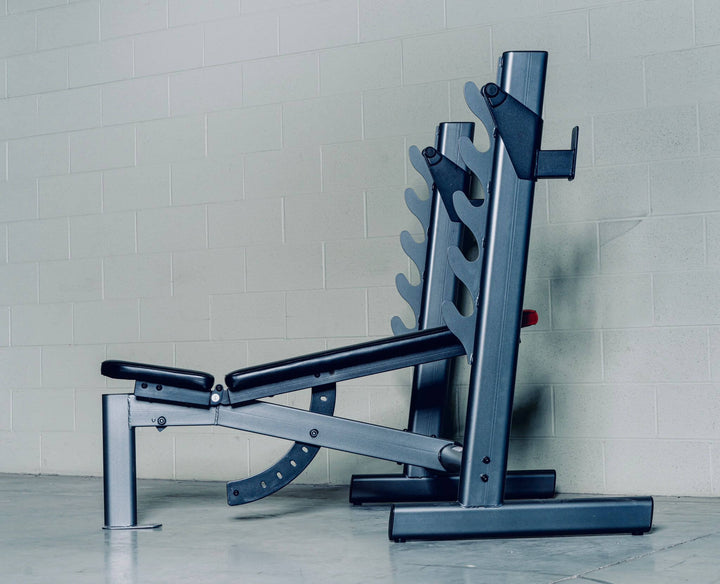 Heavy-duty adjustable bench for versatile upper body workouts in a gym setting, suitable for various exercises.